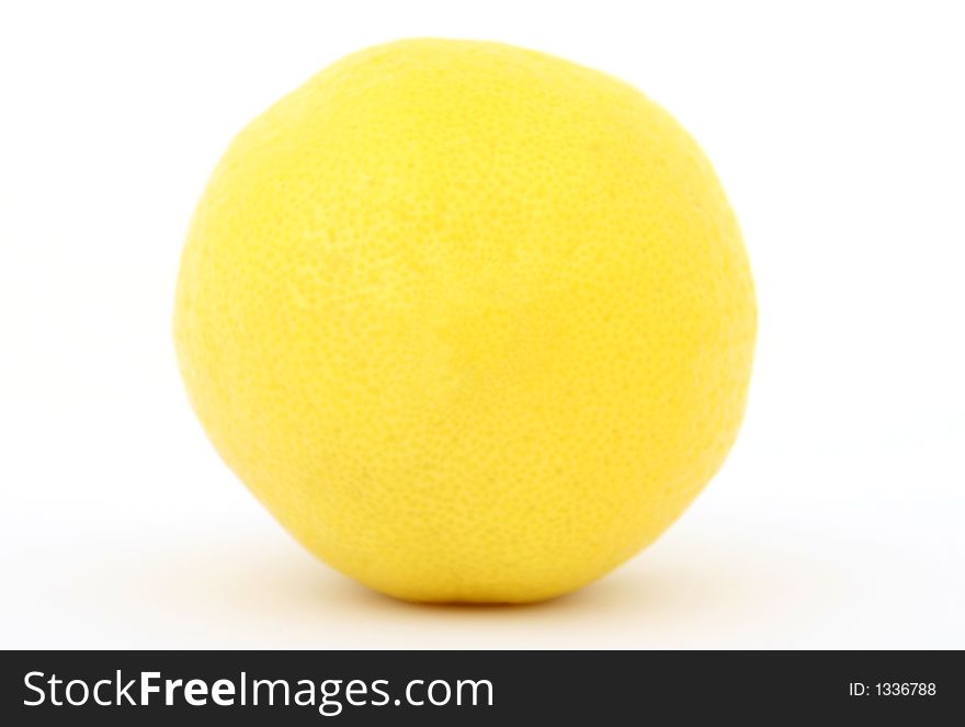 Fresh fruit, a tropical yellow lemon macro closeup, isolated on white, close-up with copyspace. Fresh fruit, a tropical yellow lemon macro closeup, isolated on white, close-up with copyspace