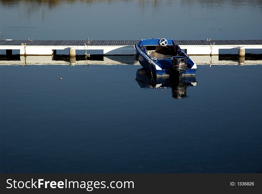 Lake mole with clear blue ad peacefully water and boat. Lake mole with clear blue ad peacefully water and boat