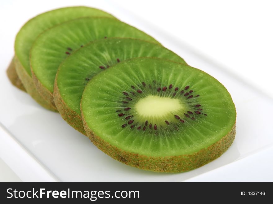 Fresh tropical green kiwi fruit, macro closeup, isolated on white, close-up with copyspace. Fresh tropical green kiwi fruit, macro closeup, isolated on white, close-up with copyspace