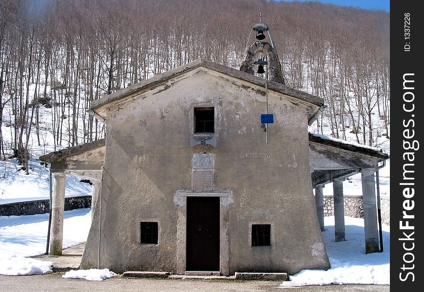 Small mountain Catholic church in a mountain landscape in Italy. Small mountain Catholic church in a mountain landscape in Italy