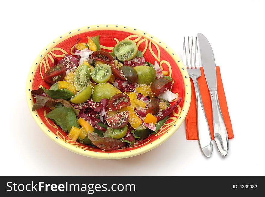 Healthy serving of salad isolated on a white background.