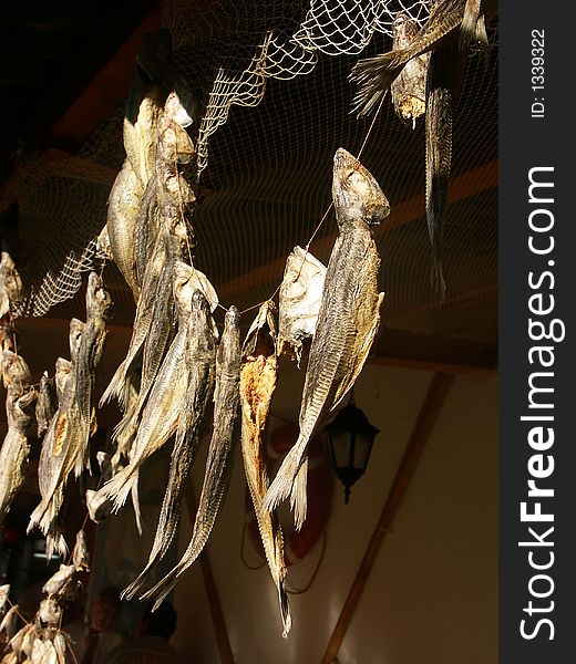 Smoked fish hanging outside fisherman's house