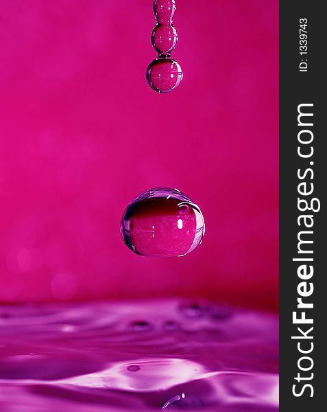 Frozen drop on purple background