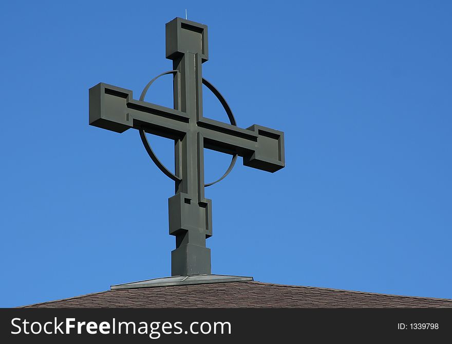 Large cross against a bright blue sky. Large cross against a bright blue sky