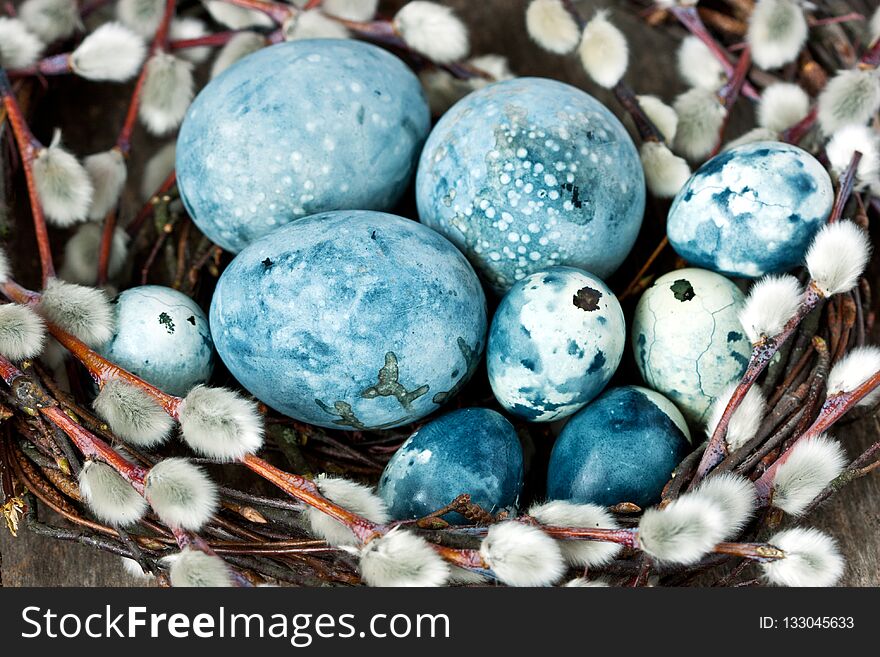 Colorful easter egg in the nest on wooden background. Colorful easter egg in the nest on wooden background