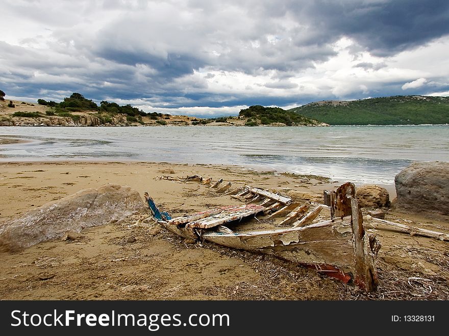 Old ruined boat on the sandy beach. Old ruined boat on the sandy beach