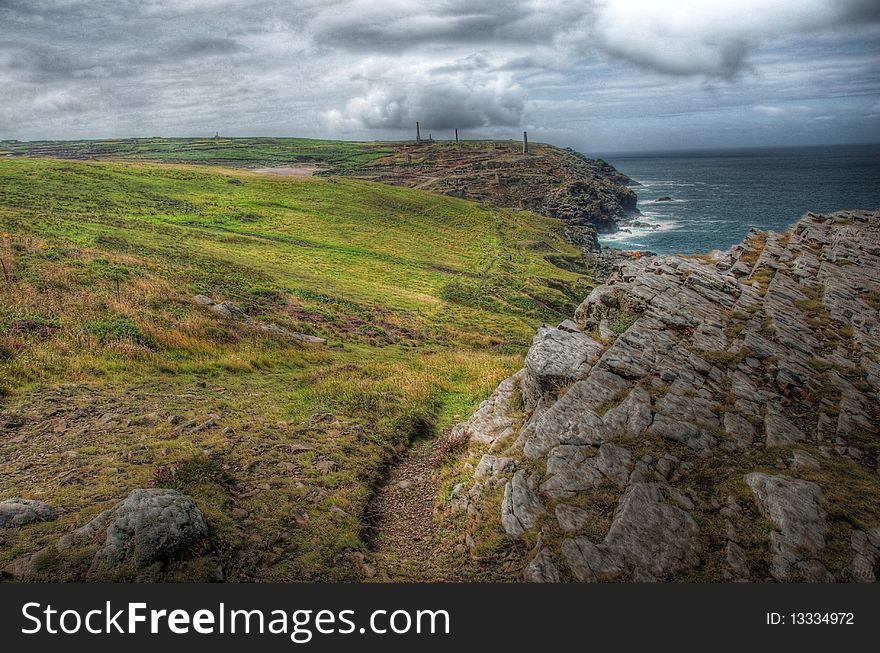 Cliffs of Cornwall with old mine in the background. Cliffs of Cornwall with old mine in the background