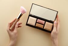 Woman`s Hands Holding Make Up Palette And Brush Royalty Free Stock Images
