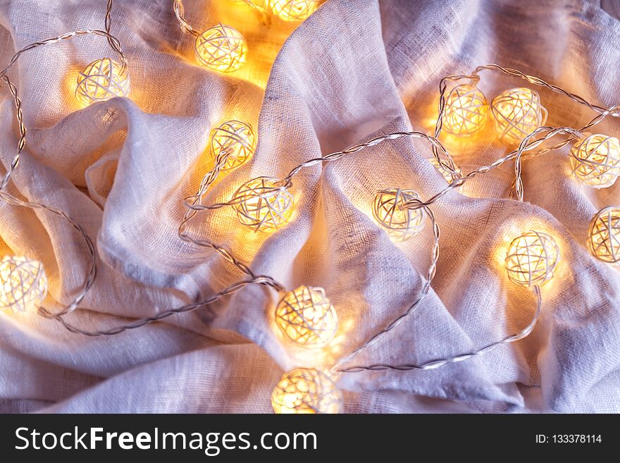 Background Of Garlands With Lights On The Folds Of Fabric In Blu