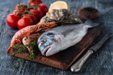 Fresh Sea Fish Dorado With Oysters And Shrimp And Vegetables. Stock Photos