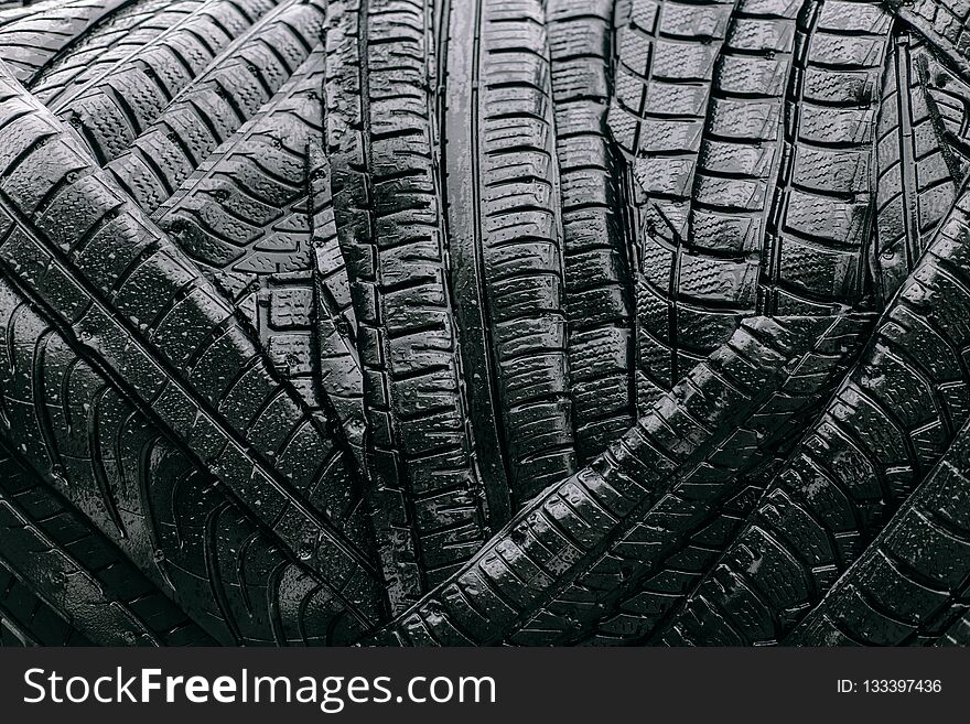 Texture of black and wet car tires