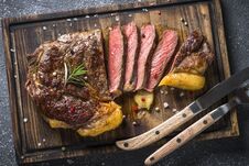 Grilled Beef Steak Ribeye On Wooden Cutting Board. Stock Photo