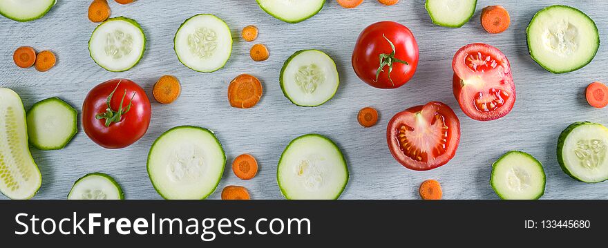 Wide photo vegetables on wooden background