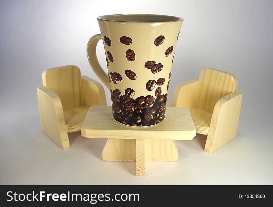 Big coffee cup on wooden table