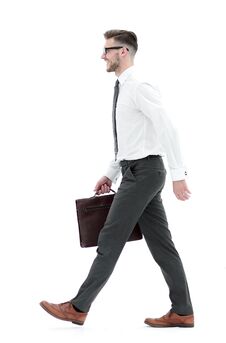 Free Side View.a Confident Businessman With A Leather Briefcase Goes Forward Stock Photo - 133503120