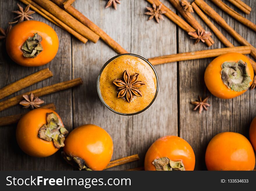 Fresh Persimmon Fruit On Wooden Table