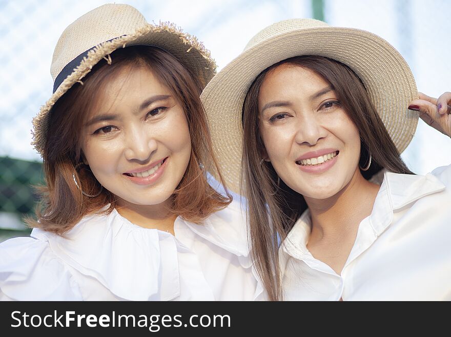 Close up face of toothy smiling face asian younger woman vacatio