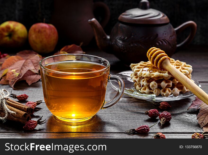 A cup of tea on a wooden background. A cup of tea on a wooden background