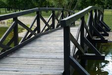 Wooden Foot Bridge Over Small Pond In Park Royalty Free Stock Photography
