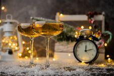 Picture Of Two Wine Glasses On Blurred Background With Christmas Tree, Lantern, Clock Stock Images
