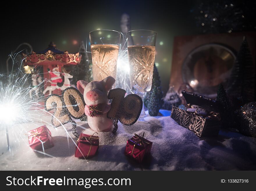 Two glasses of champagne with Christmas decoration. Traditional winter holiday alcohol drink in snow with creative New Year