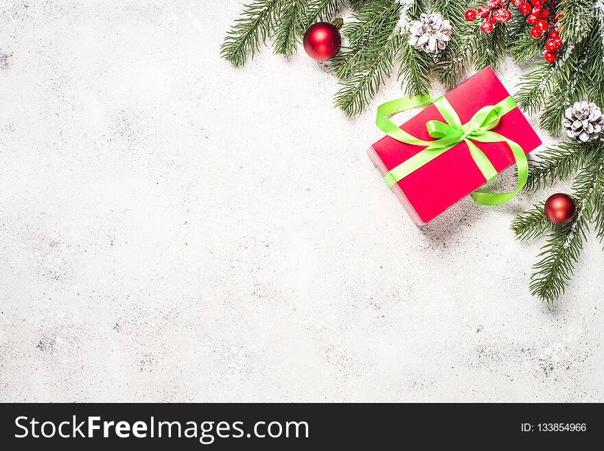 Christmas background with fir tree, present box and decorations