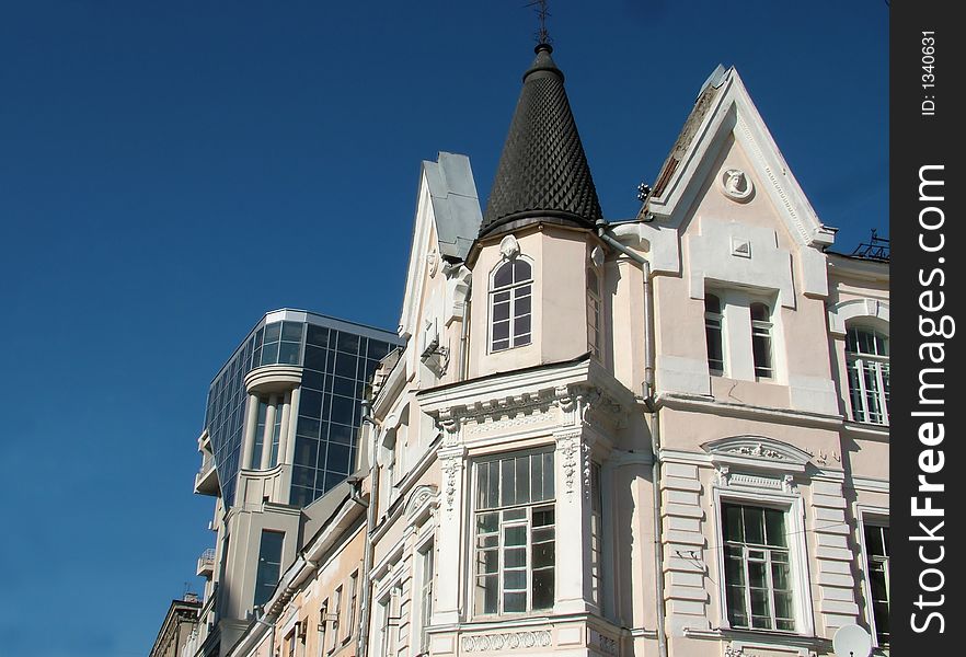 View of a modern and a historical buildings side by side. View of a modern and a historical buildings side by side