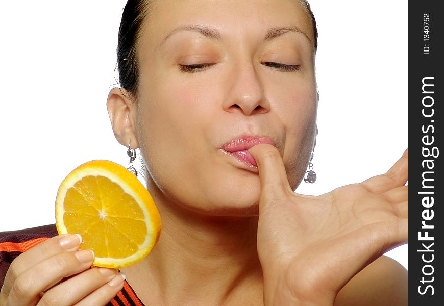 Young woman with piece of orange