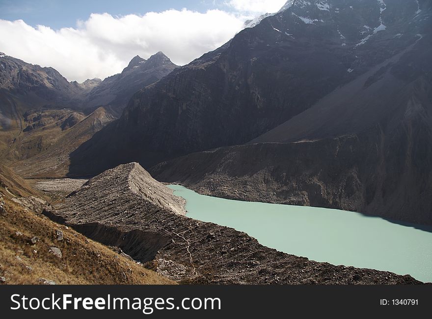 Green lake under Alpamayo peak in the Cordilleras