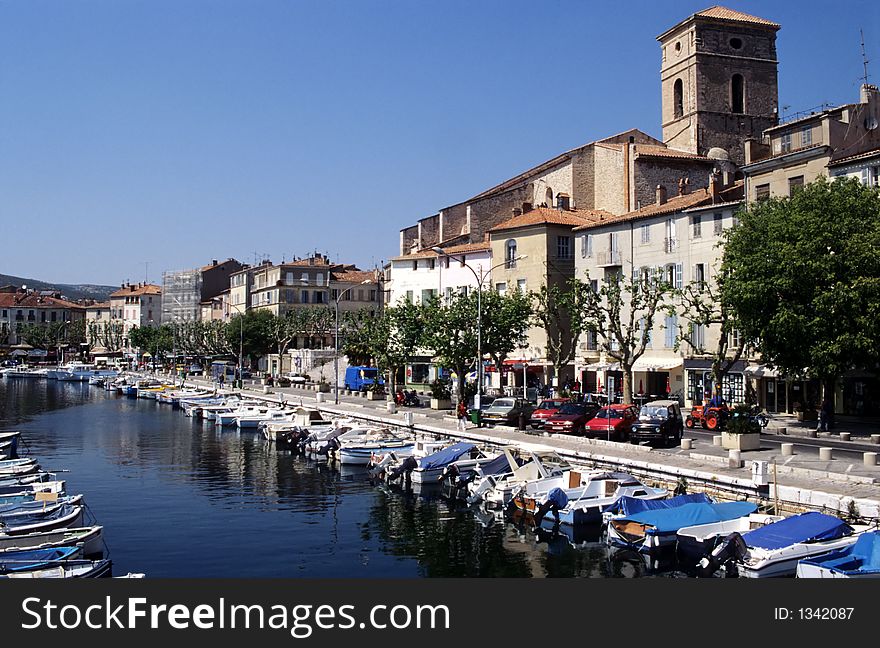 La Ciotat old port showing fisher and other small boats and antique church, french riviera, europe