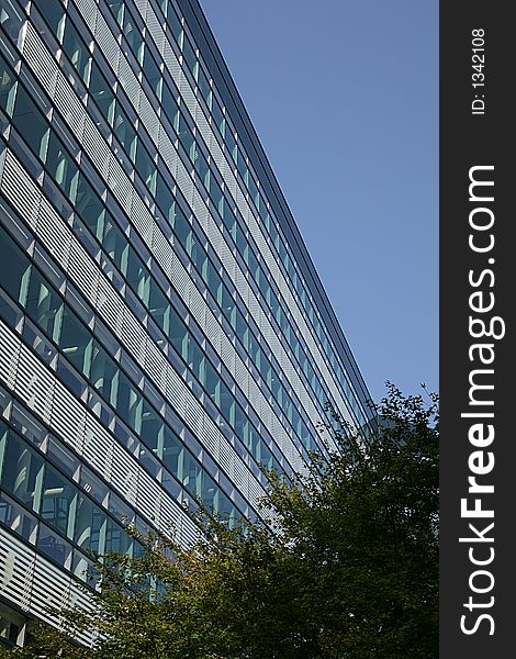 Windows on blue building against blue sky. Windows on blue building against blue sky