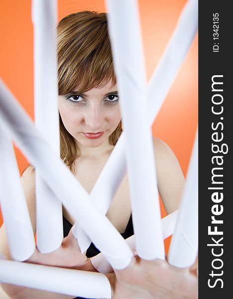 Funny looking cute girl poses with scissor fingers made out of paper - Freddy Kruger style