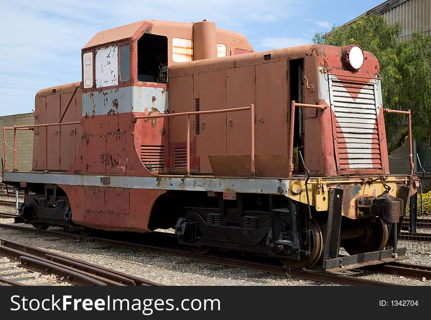 An old diesel-electric train waits to be restored at a museum. An old diesel-electric train waits to be restored at a museum.