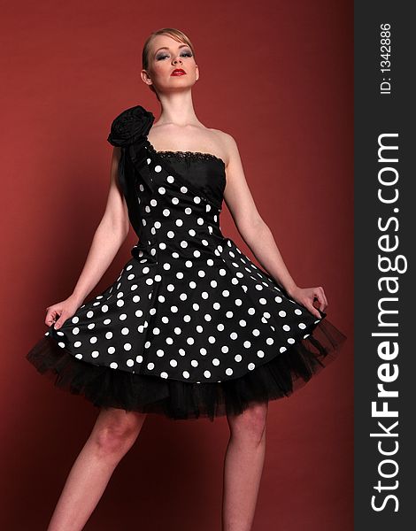 Fashion girl in black polka dot dress. Fashion girl in black polka dot dress