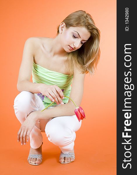 Blond Teenager With Red Tulip