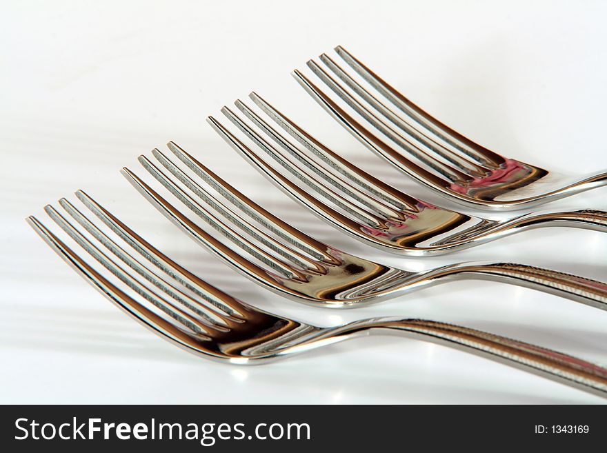 A row of four forks