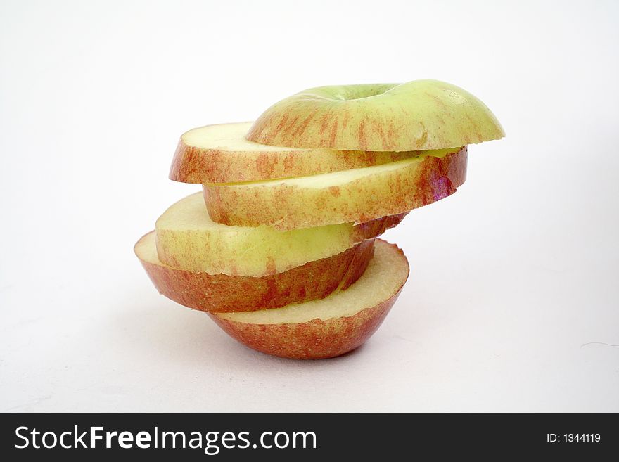 Six apple slices on-top of each other. Six apple slices on-top of each other.