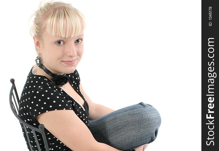 Portrait of beautiful seventeen year old girl.  Natural beauty, no make-up.  Sitting in black iron chair. Portrait of beautiful seventeen year old girl.  Natural beauty, no make-up.  Sitting in black iron chair.