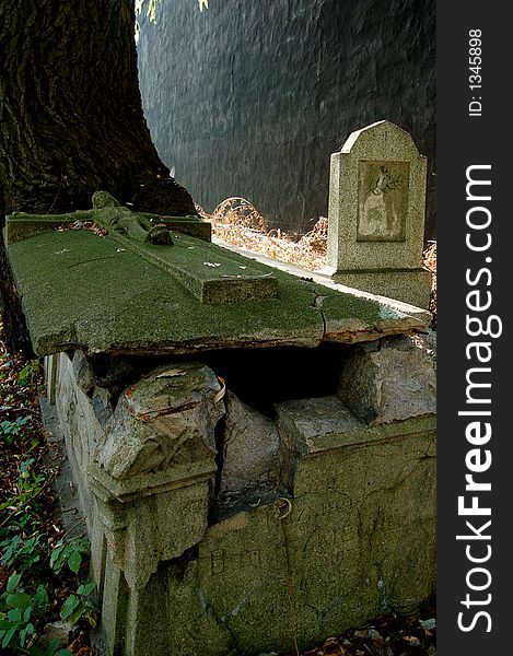 An old grave with a stone cross