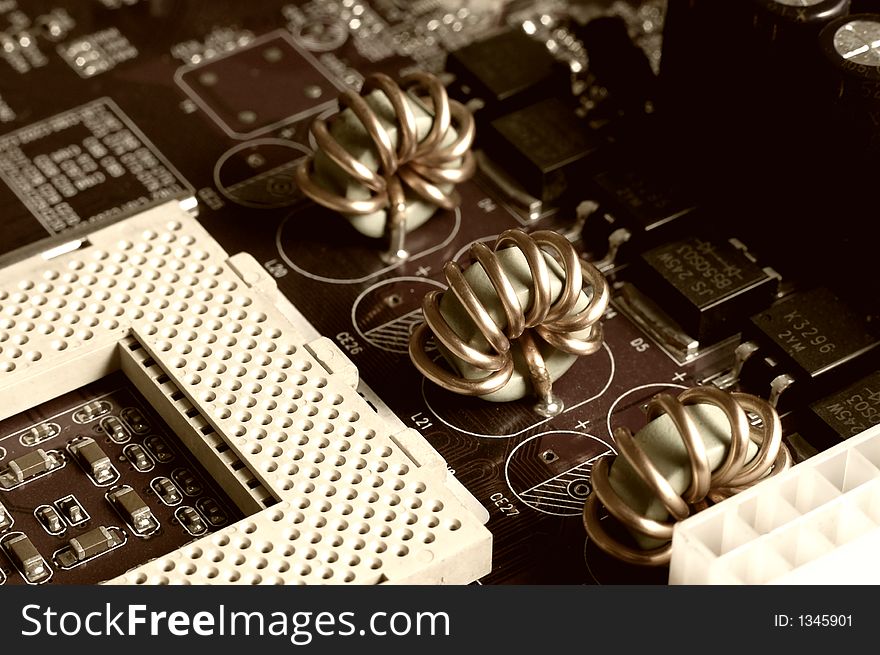 Motherboard - processor socket and coils, sepia.