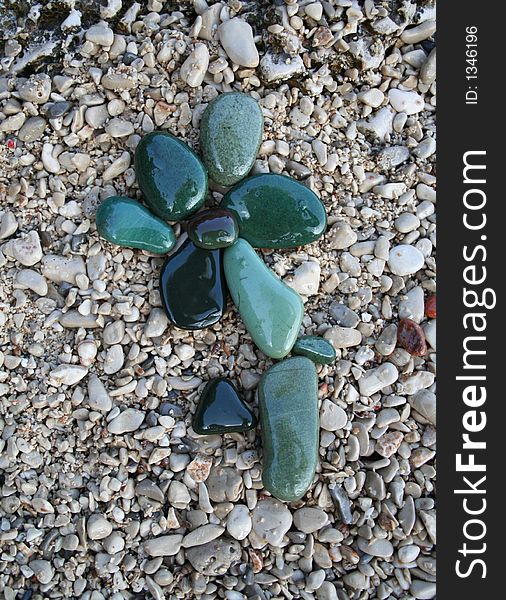 Green stones flower on the gray background