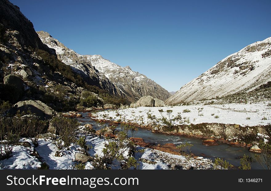 Snowcovered grassland and river in morning for mountain. Snowcovered grassland and river in morning for mountain