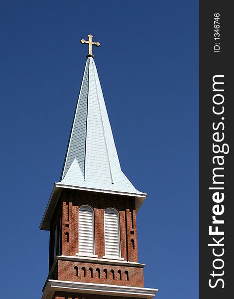 Church steeple against blue sk