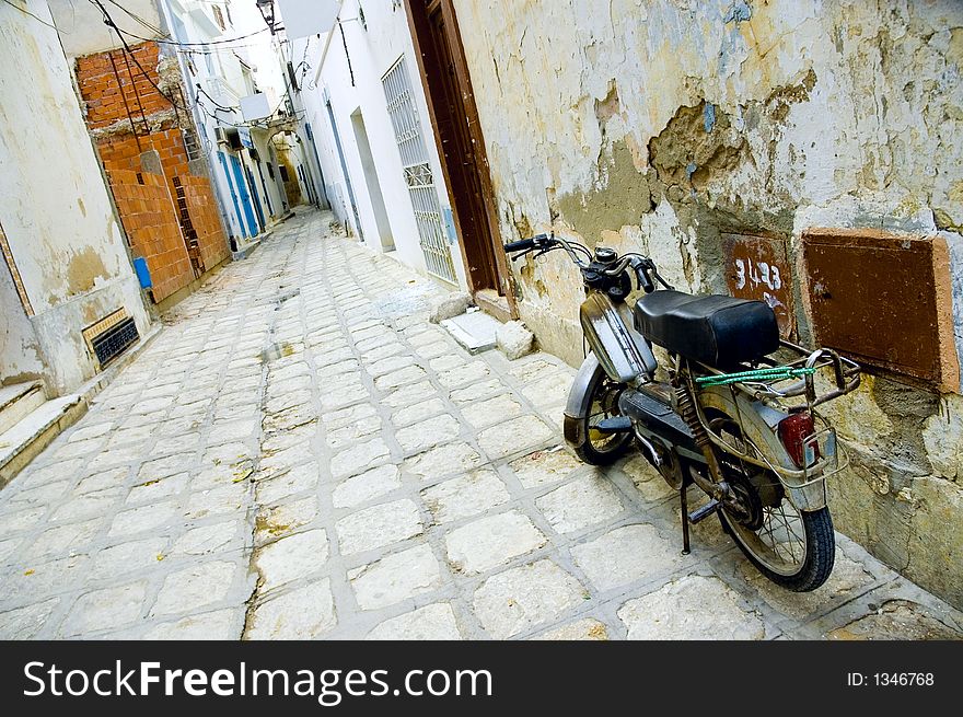 Motorcycle at arabian street in medina, Tunis, Tunisia
