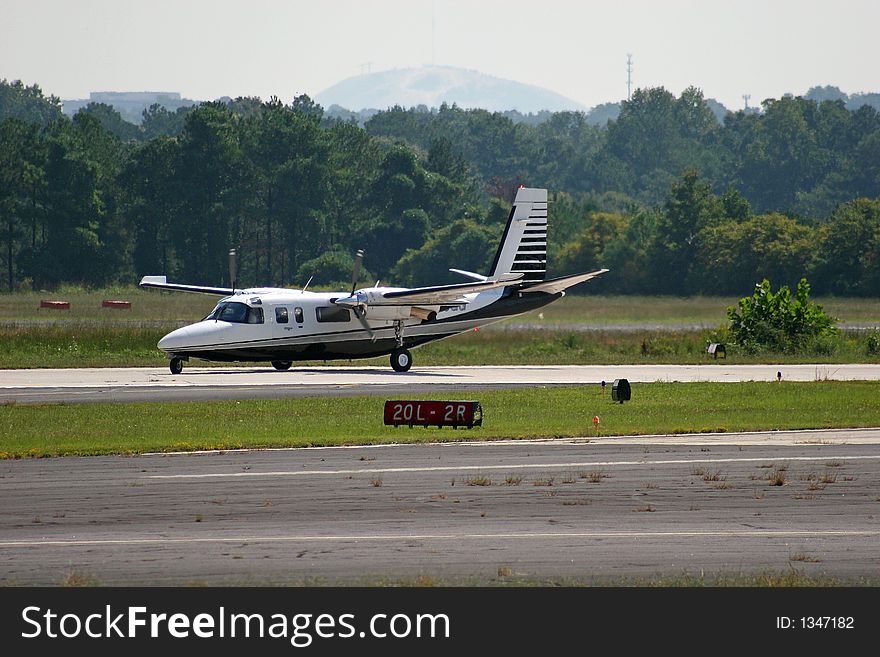 Private plane landing at small airport