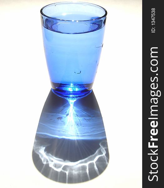 Isolated blue glass of water
