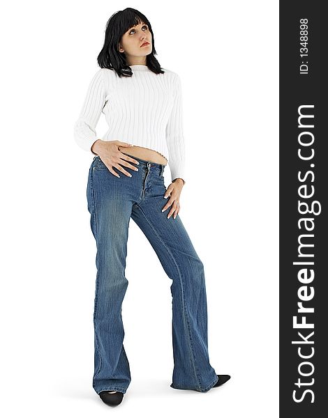 Beautiful young woman in jeans and white sweater standing, wondering.  Clipping path. Beautiful young woman in jeans and white sweater standing, wondering.  Clipping path.