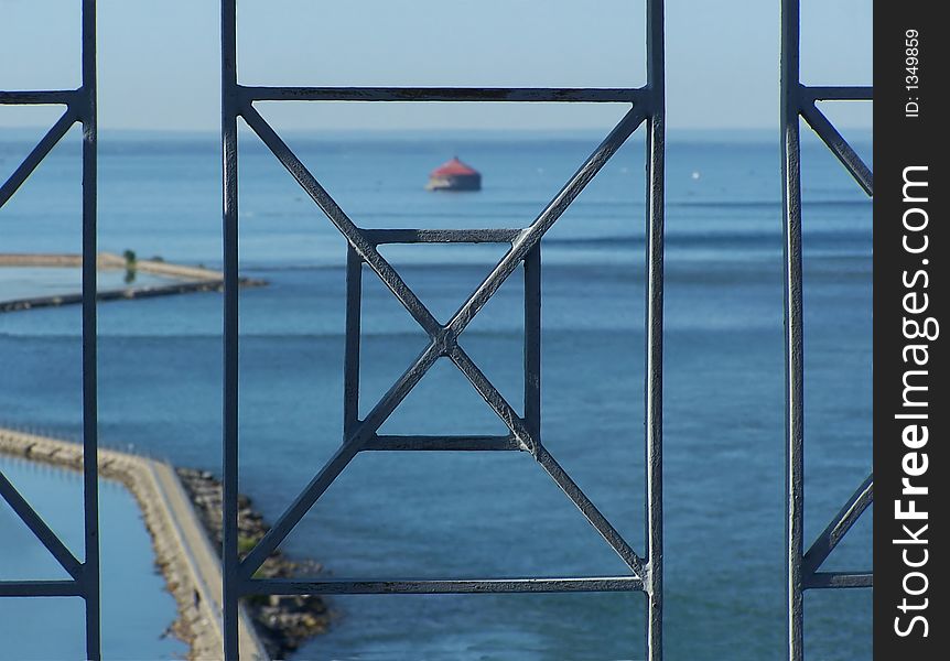 View of Harbour through geometric railing. View of Harbour through geometric railing