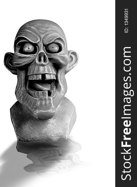 Ghoulish gargoyle face perfect for Halloween, with reflection. Ghoulish gargoyle face perfect for Halloween, with reflection