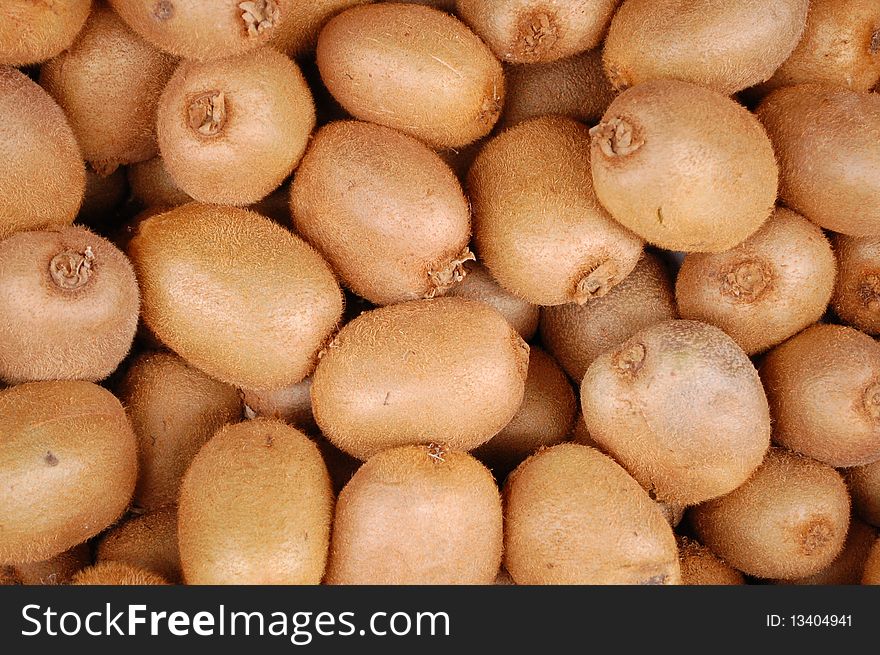 A collection of brown kiwi fruit